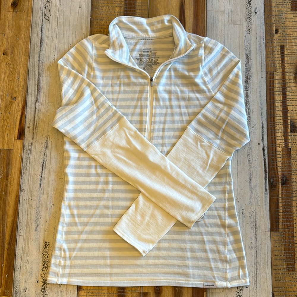 Patagonia women’s medium base layer.  Grey and cream colored stripe.